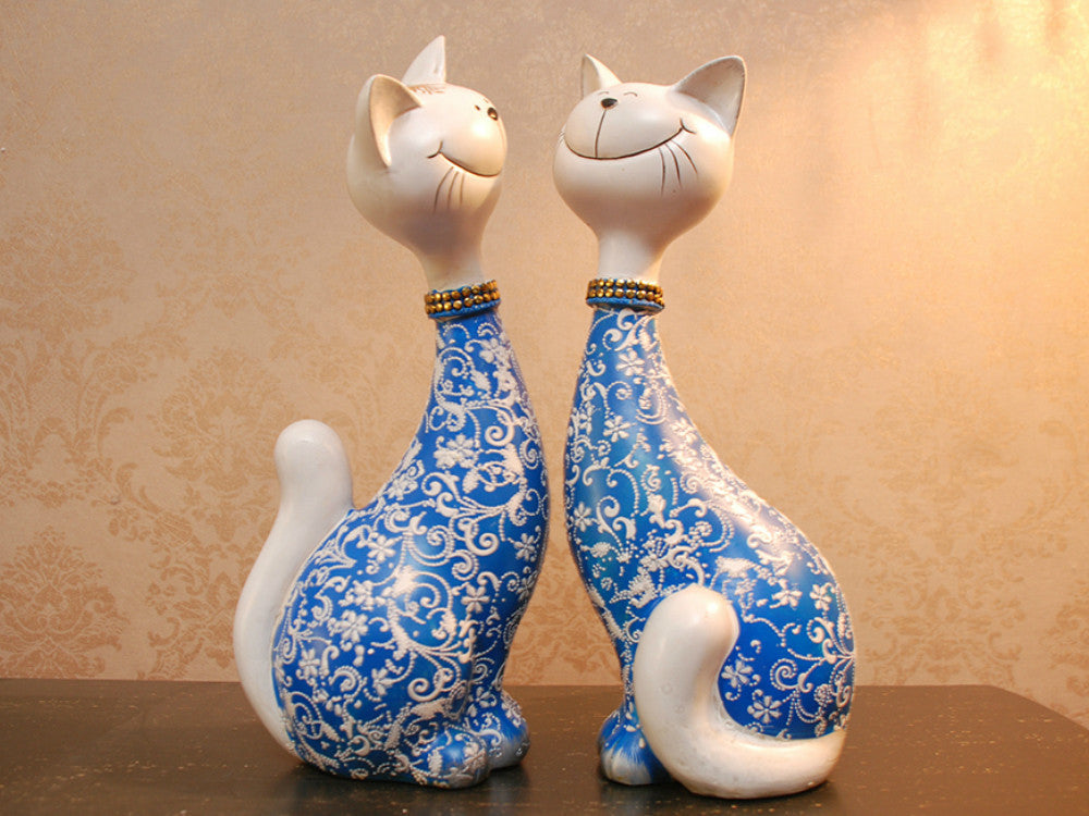Two hand-painted blue happy cat resin sculptures for table decor.