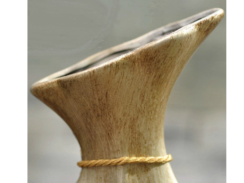Antique brown resin vase with textured surface, suitable for floral arrangements.