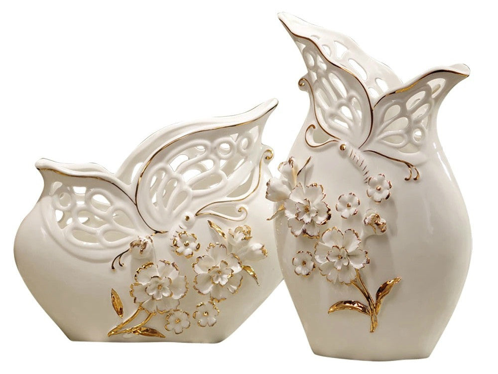 Two white porcelain vases with basket weave texture, pinched flower details, and gold accents.