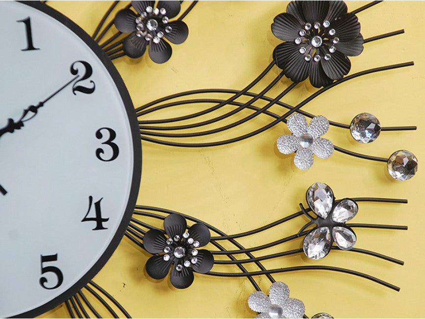 Black metallic wall clock with jewels and gothic butterfly design