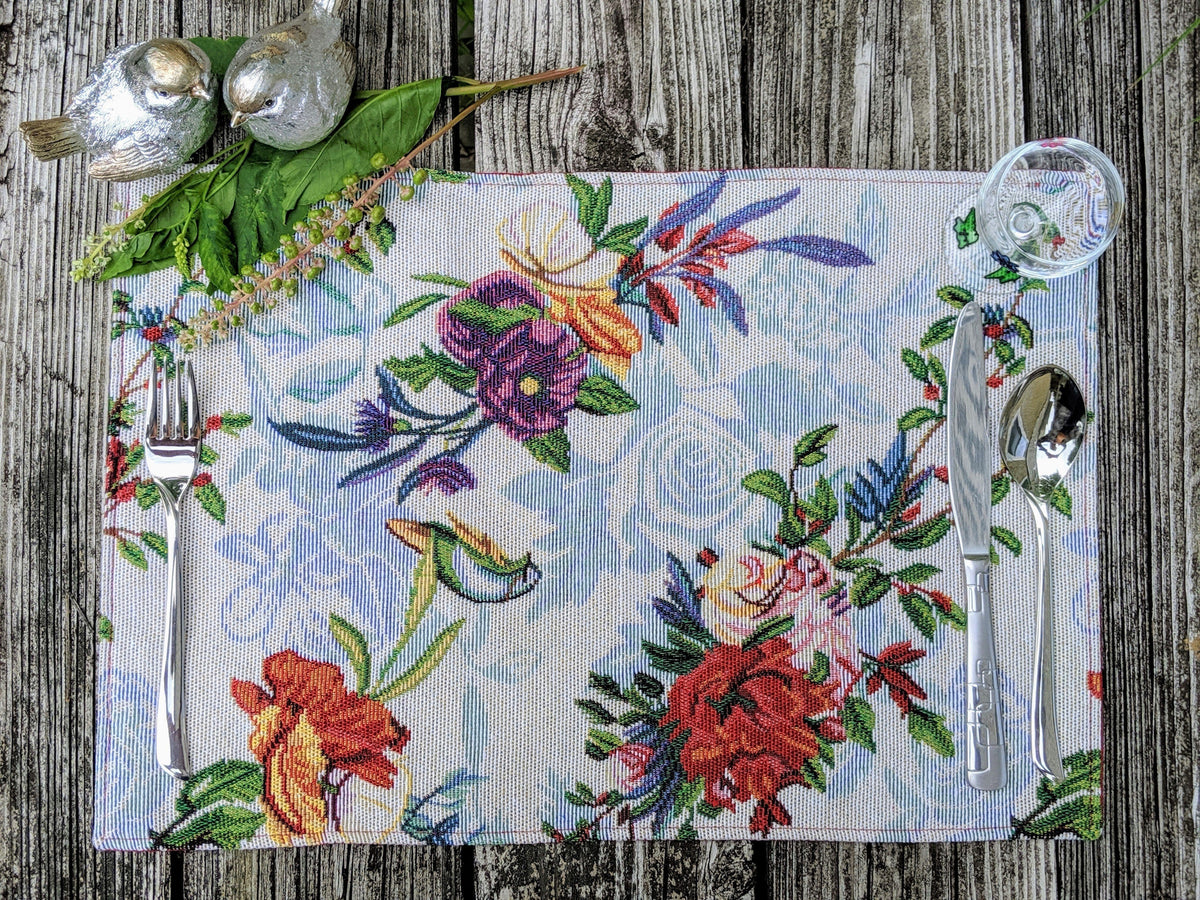 Four tropical sky blue bird and floral tapestry placemats, 13x19 inches.