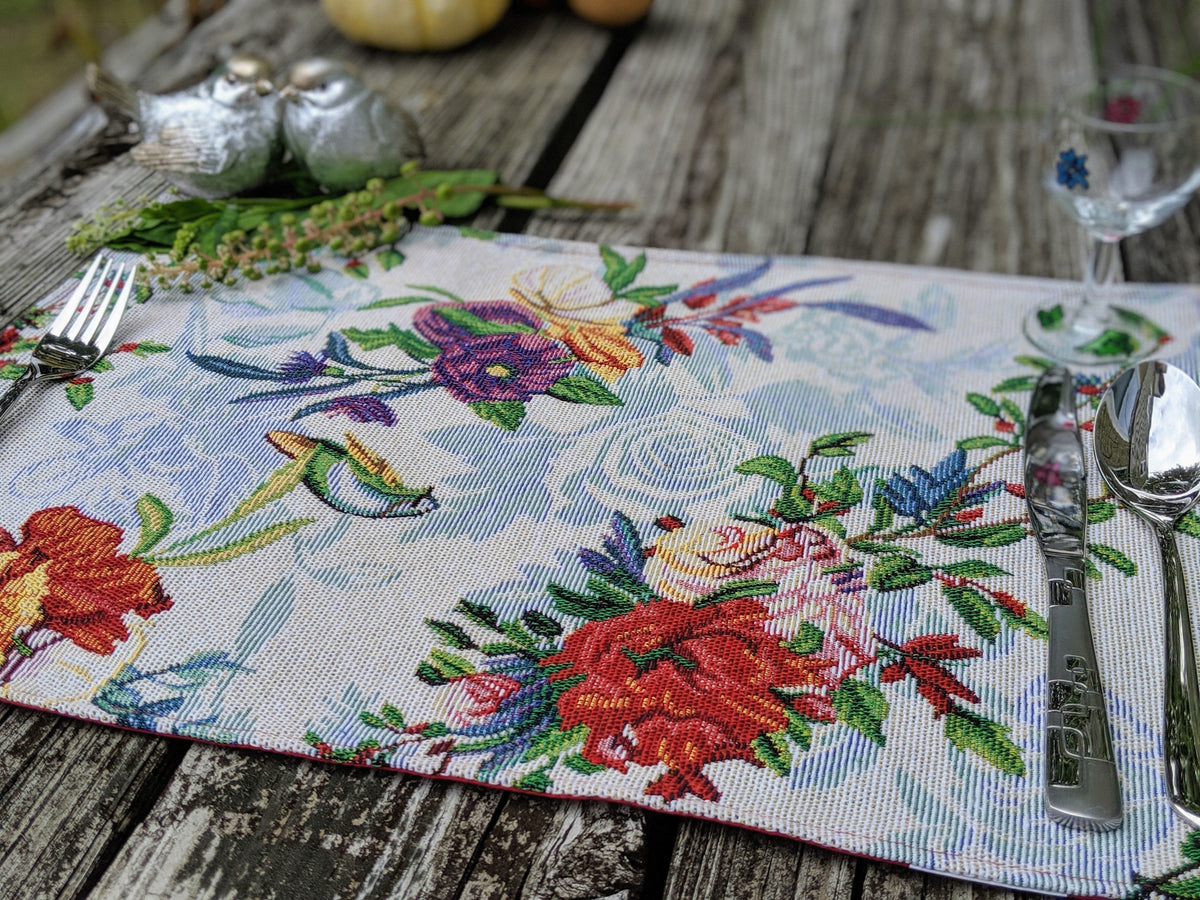 Four tropical sky blue bird and floral tapestry placemats, 13x19 inches.