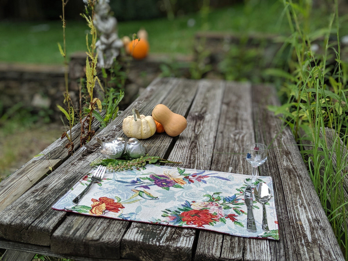 Four tropical sky blue bird and floral tapestry placemats, 13x19 inches