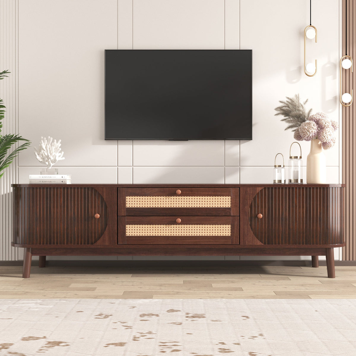 Modern farmhouse rattan TV stand in natural wood finish, holding a large TV.