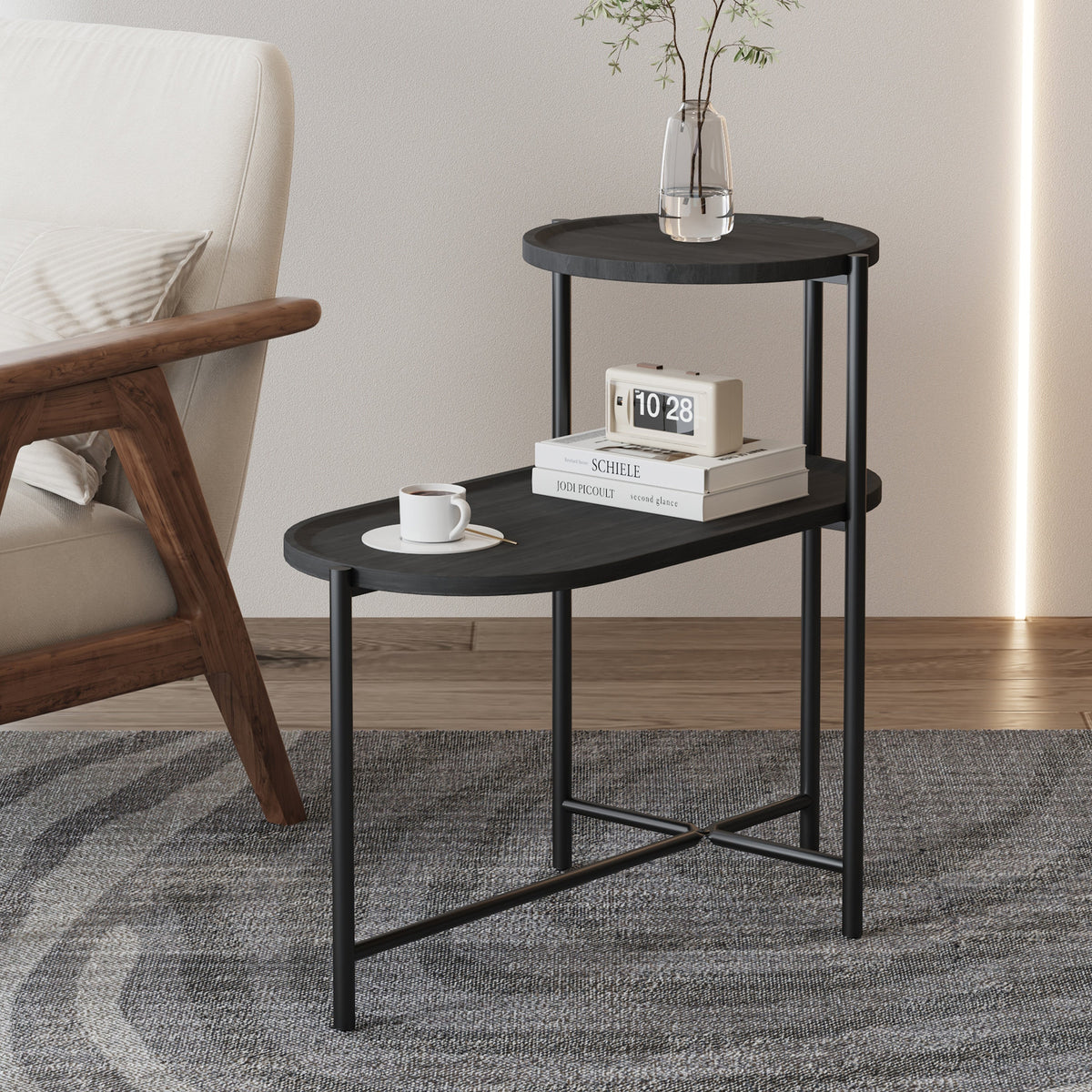 Two-tier round coffee table with storage tray and oval end tables.