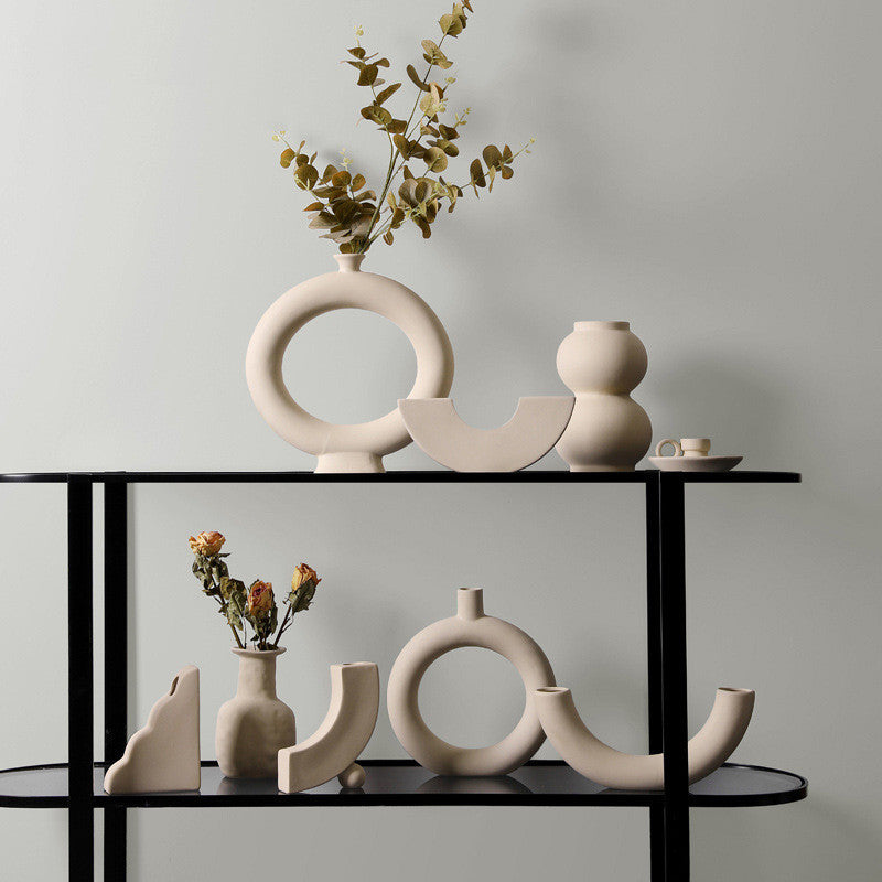 Taupe ceramic vase set with matching candle holders, modern minimalist decor.