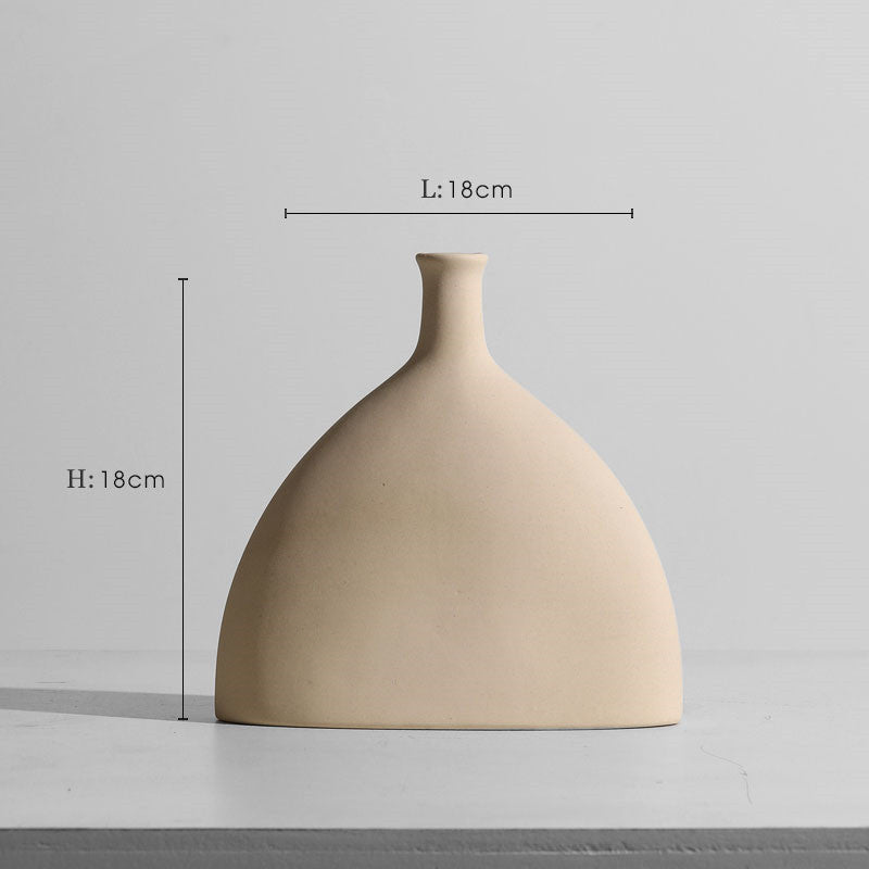 Taupe ceramic vase and candle holder set, modern minimalist decor.