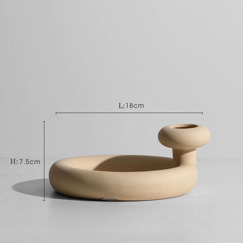Taupe ceramic vase set with matching minimalist candle holders.