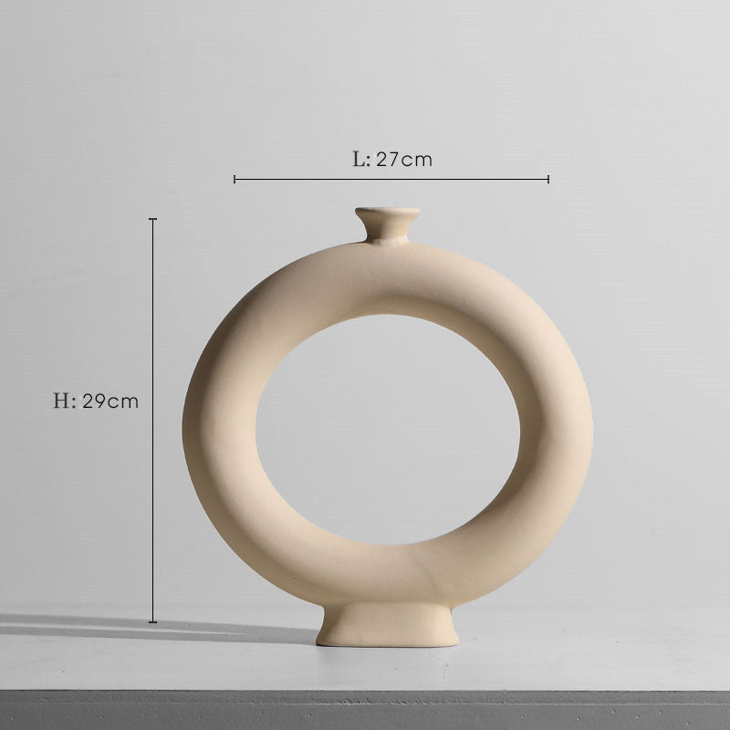 Taupe ceramic vase set with matching minimalist candle holders.
