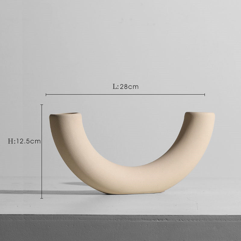 Taupe ceramic vase and candle holder set, modern minimalist decor.