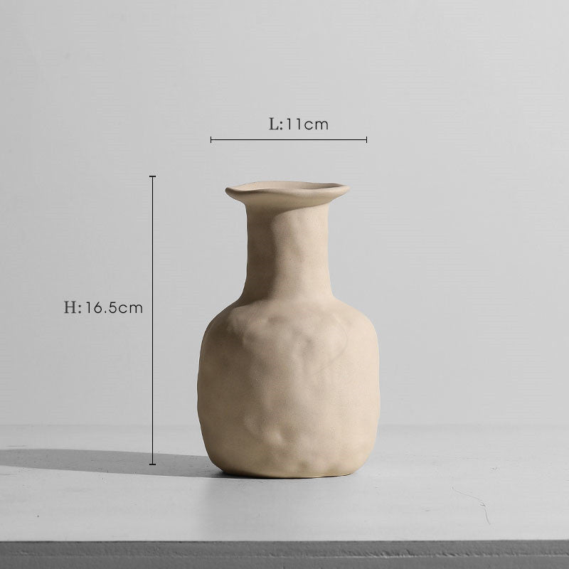 Taupe ceramic vase set with modern minimalist candle holders.