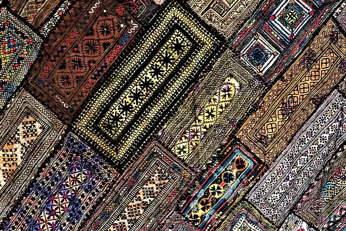 Antique Kuchi embroidered cotton tapestry bedspread with vibrant patchwork.