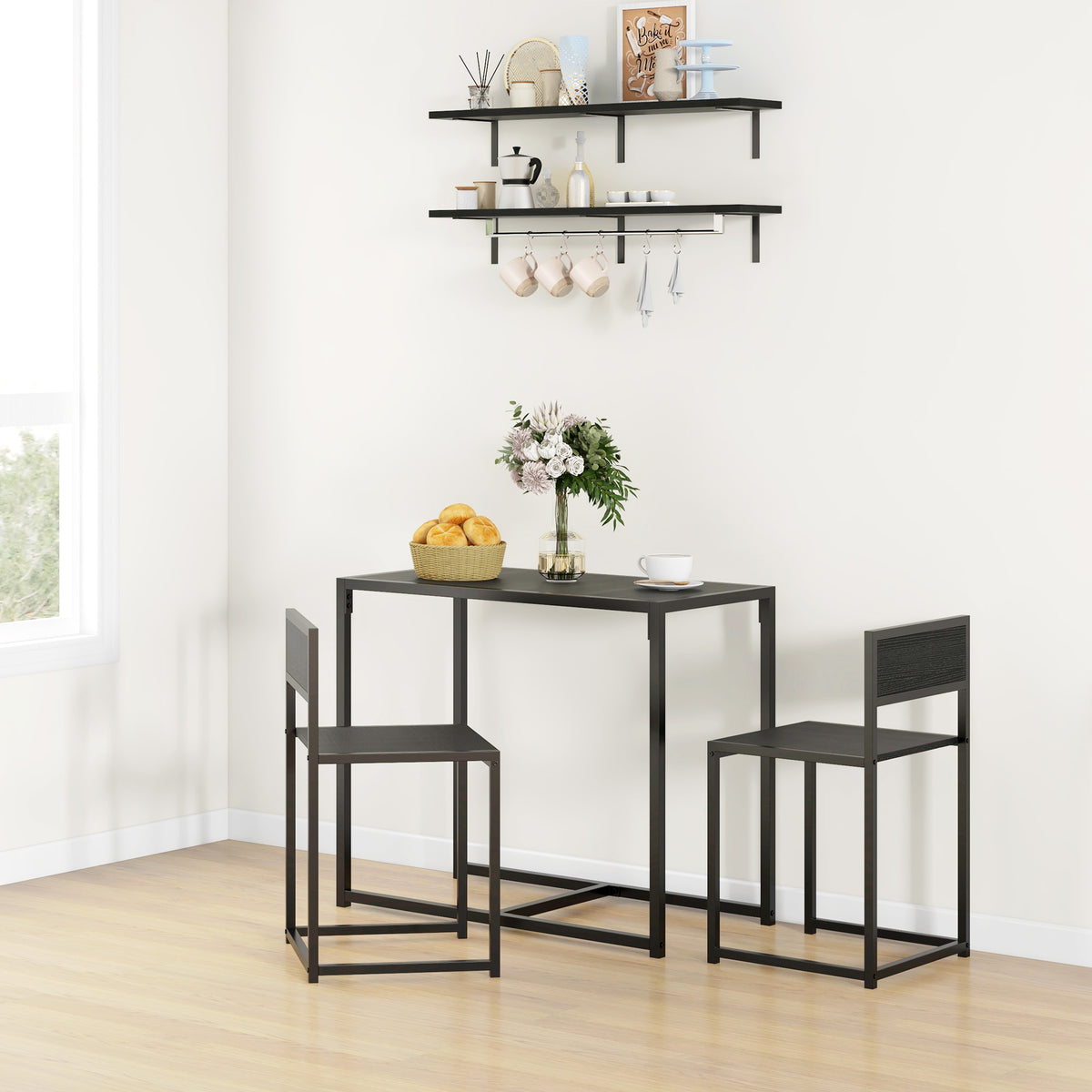 Black industrial dining set with rectangular table and two chairs.