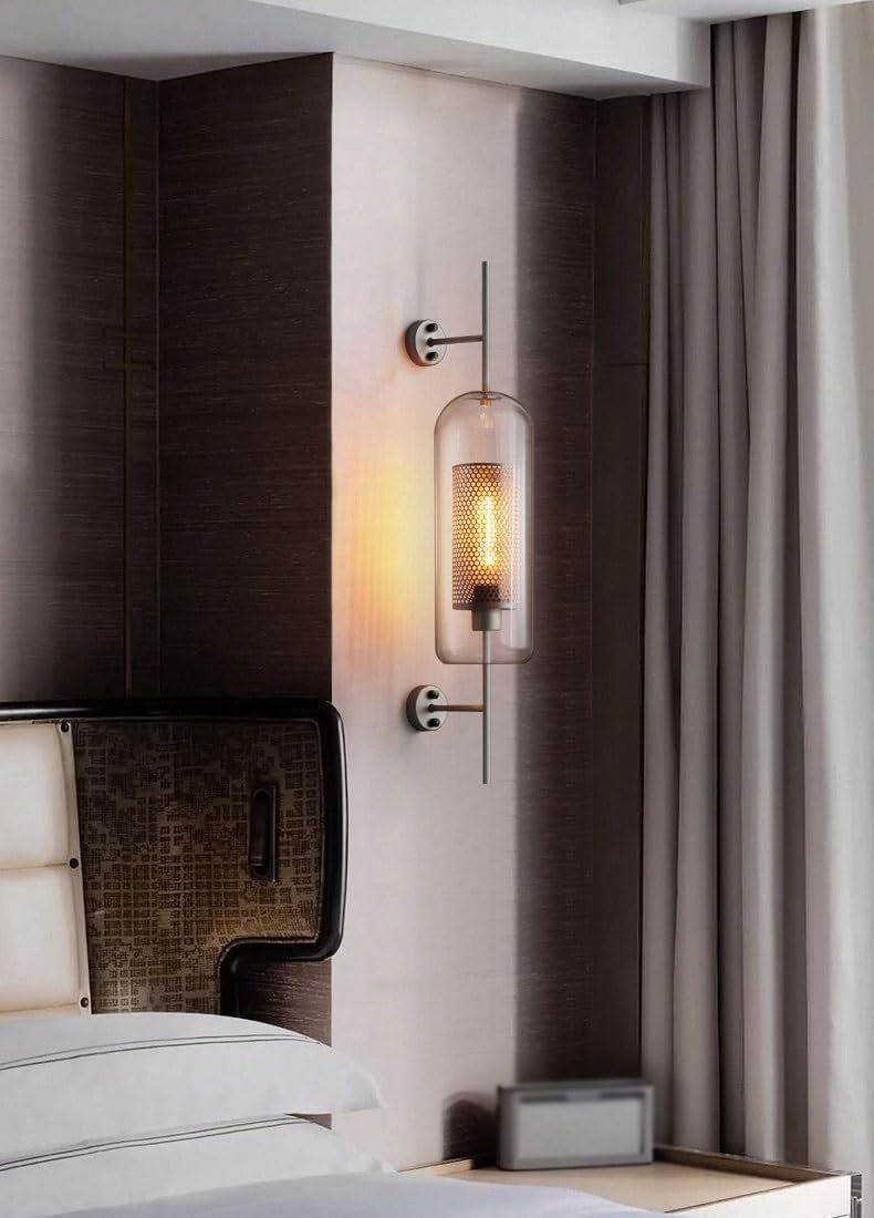 Retro industrial glass ball wall sconce with bronze finish.