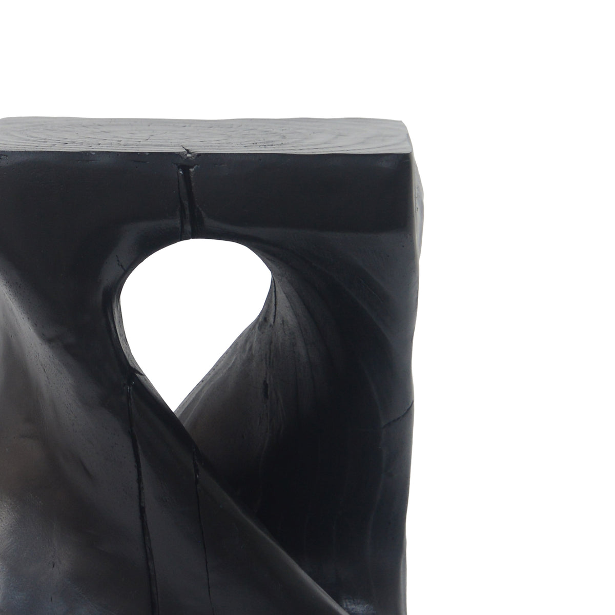 Black MGO side table with twist shape and wood grain texture.