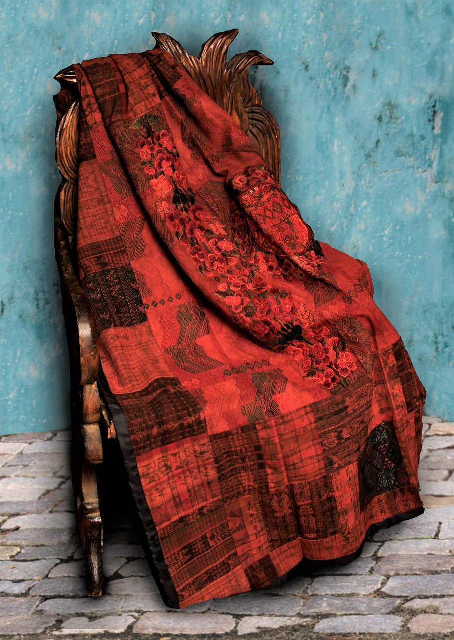 Terracotta and rust Guatemalan huipil throw blanket with embroidered woven detail.