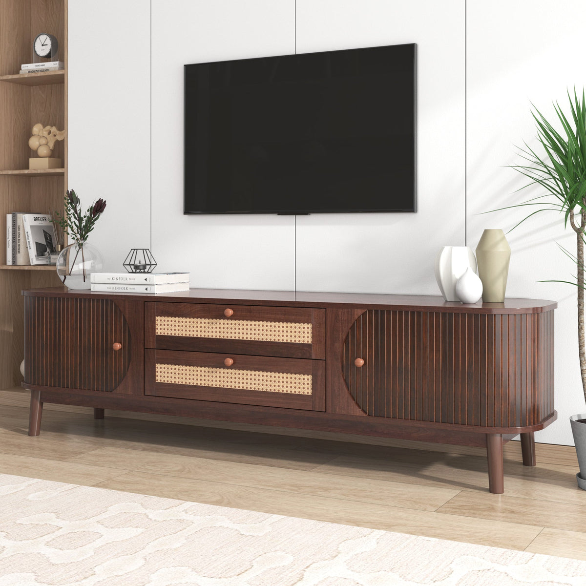 Modern farmhouse rattan TV stand in natural finish, holding a television.