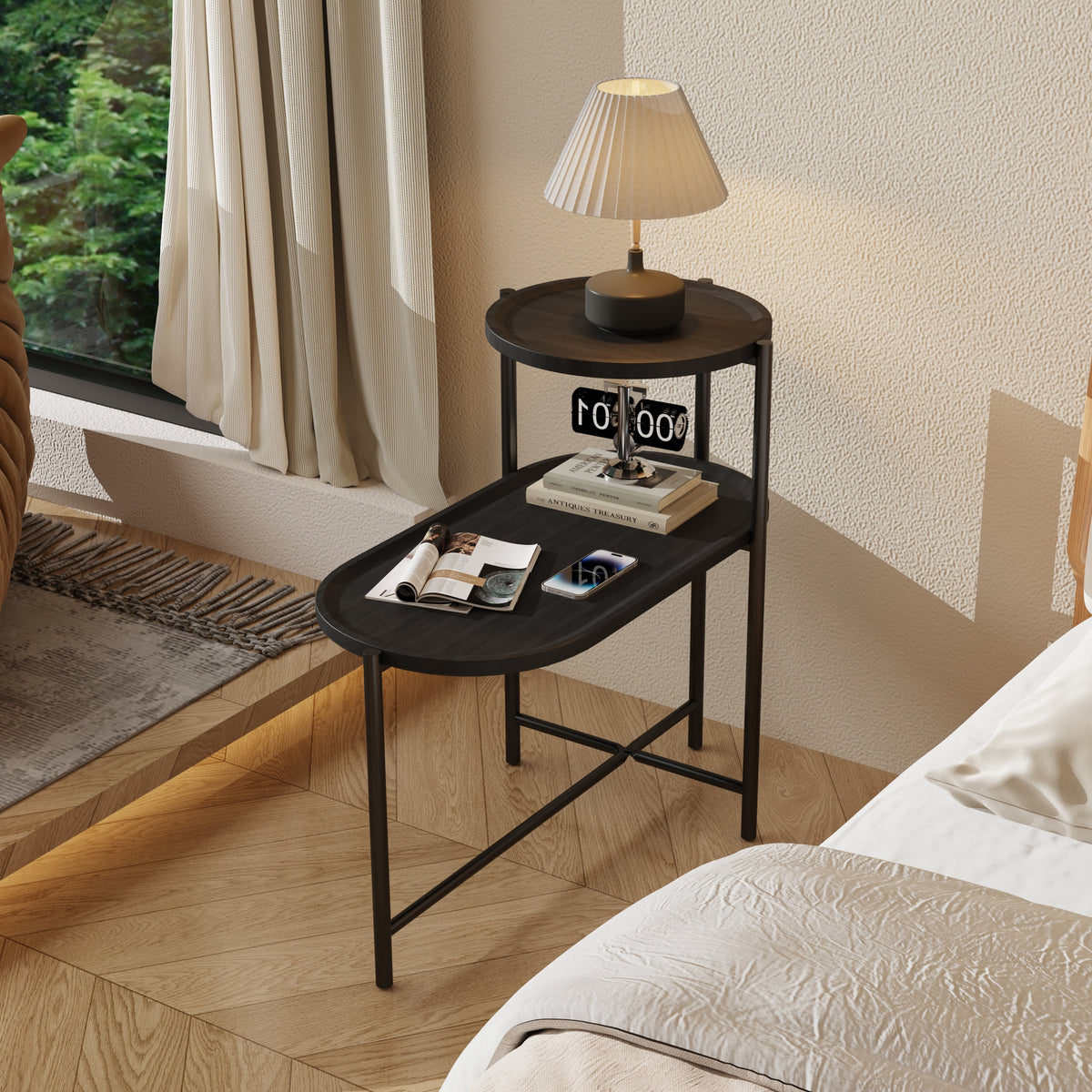Two-tier round coffee table with storage tray and oval end tables.