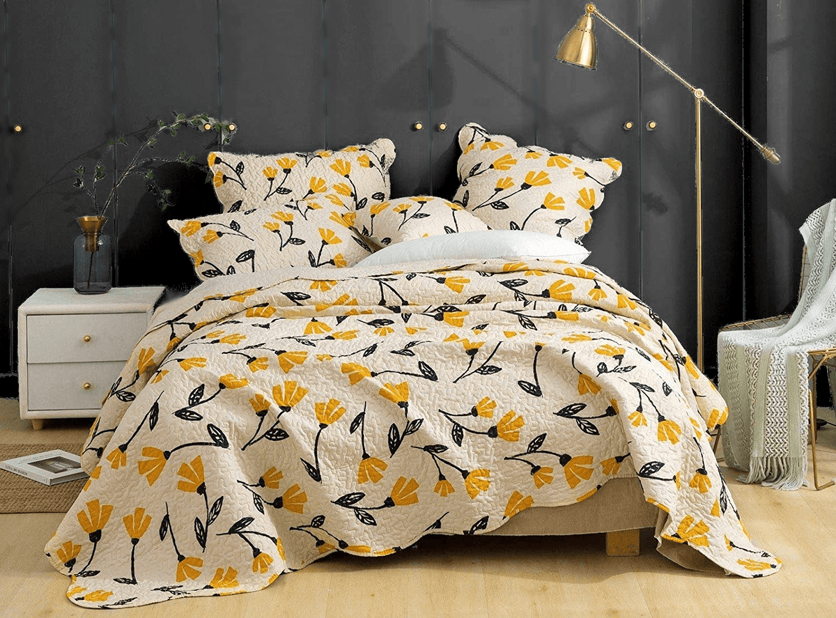 Yellow floral scalloped bedspread set with ivory cream background.