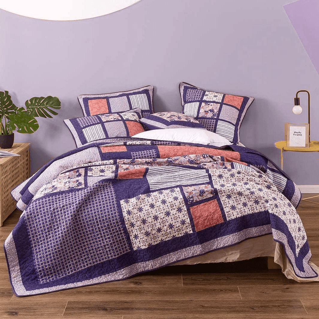 Peachy pink plum floral patchwork quilted bedspread set with pillow shams.