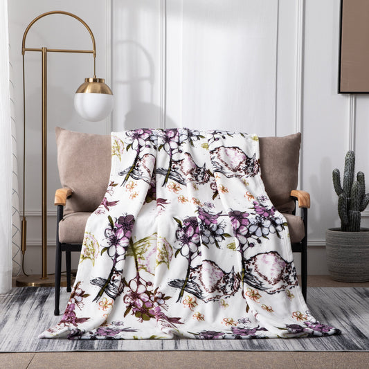 Flannel fleece throw blanket with floral blossoms and cottage birds pattern.
