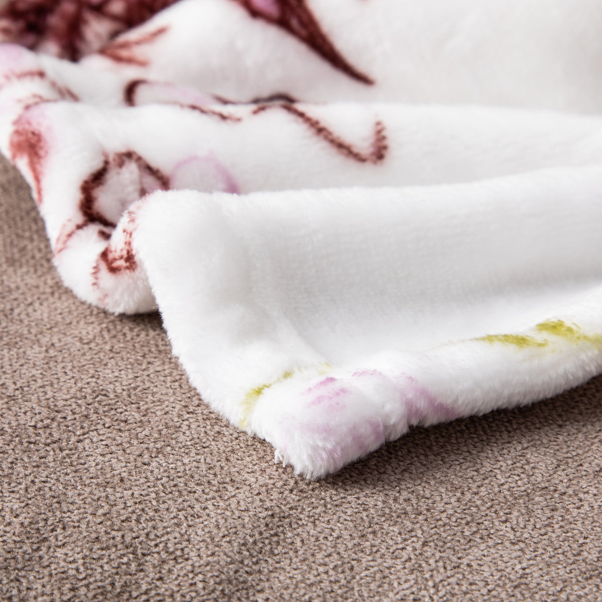 Flannel fleece throw blanket with floral blossoms and cottage birds pattern.