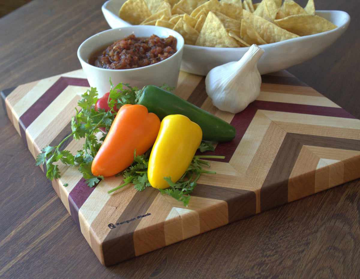 Herringbone cutting board with purpleheart, hard maple, walnut, and beech wood.