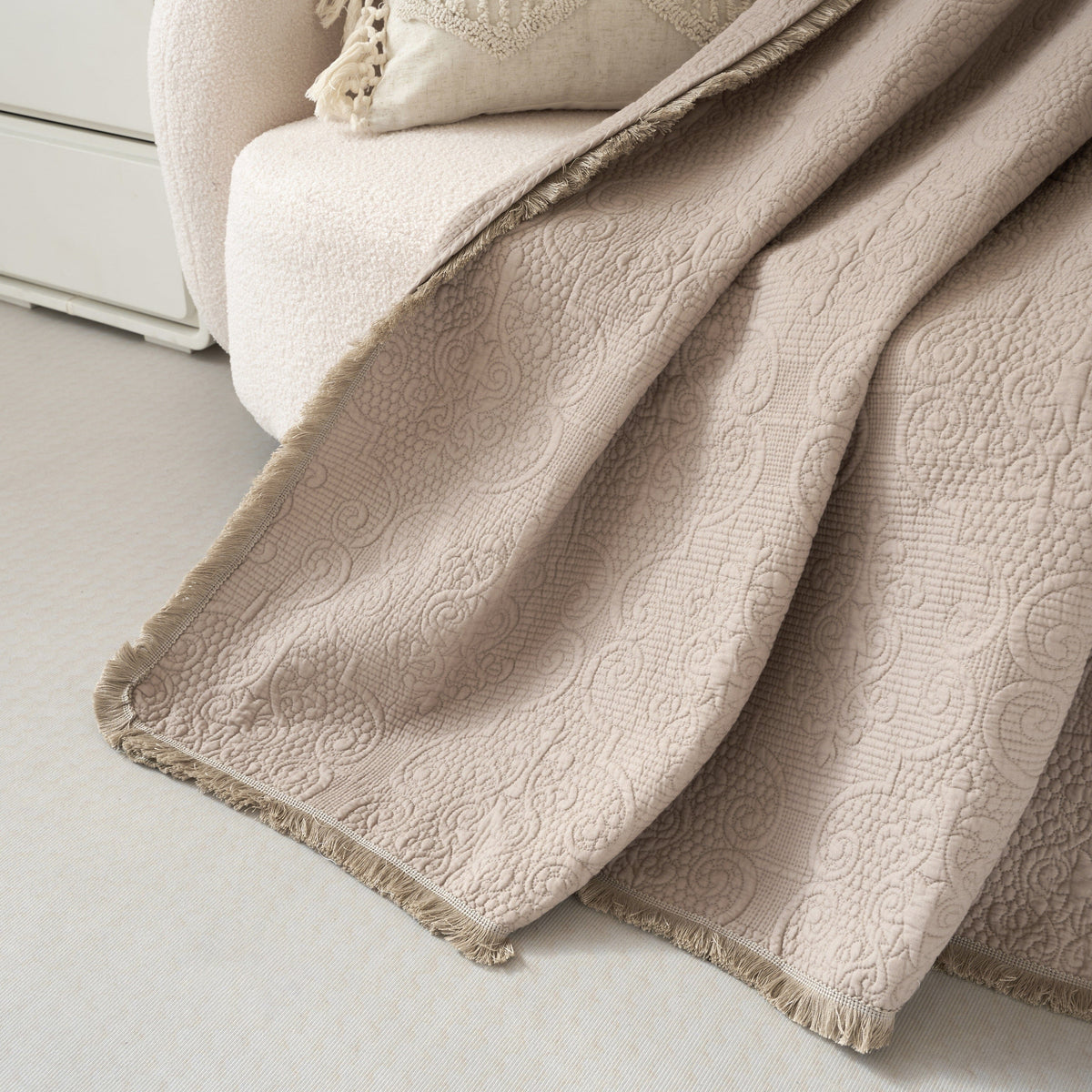 Elegant taupe beige paisley quilted throw blanket with fringe, 50x60 inches.