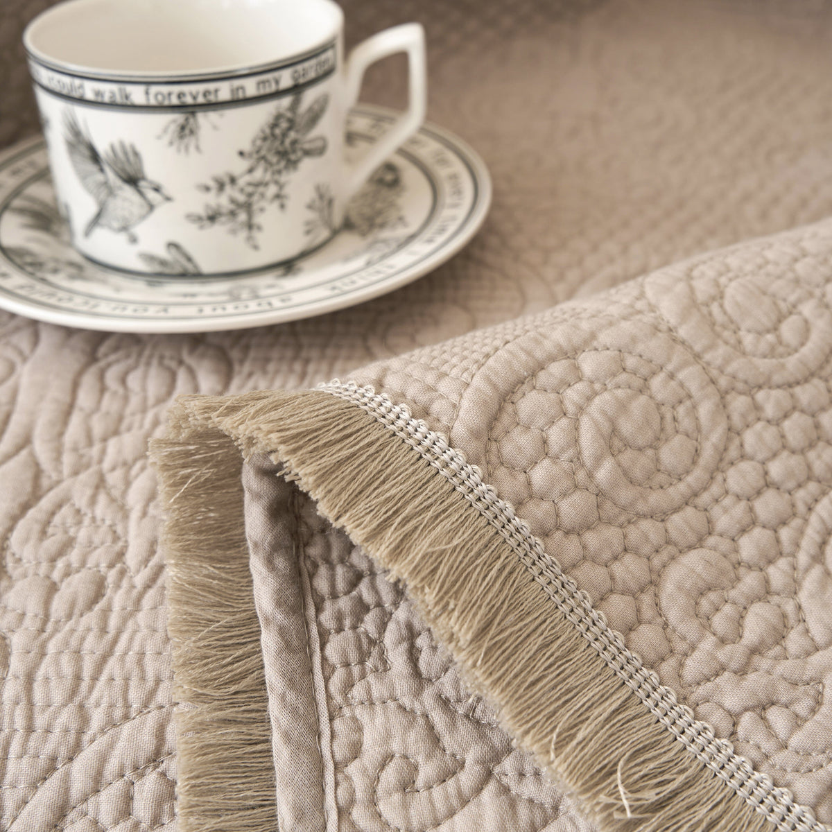 Elegant taupe beige paisley quilted throw blanket with fringe, 50x60 inches.