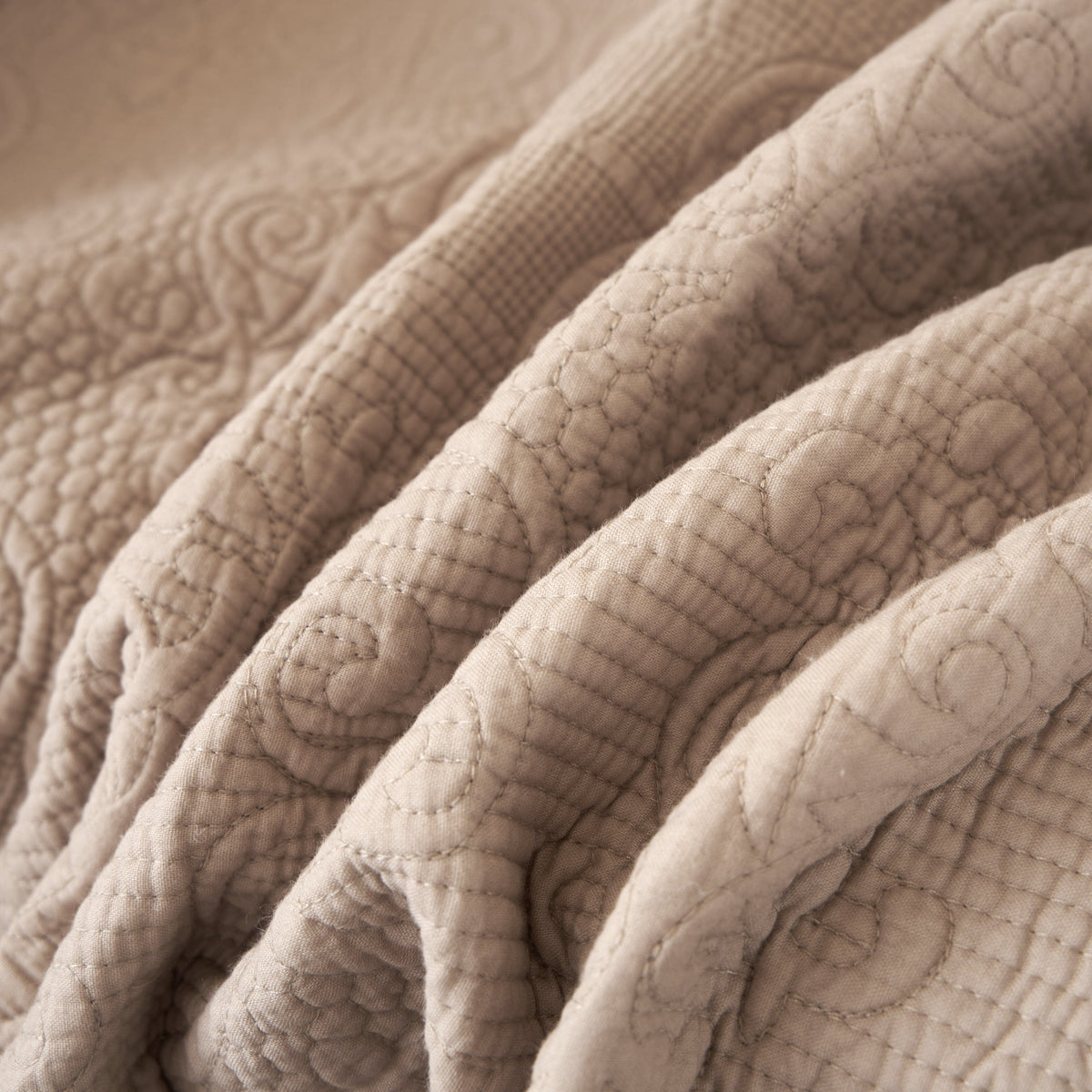 Elegant taupe beige 50x60 paisley quilted throw blanket with fringe.