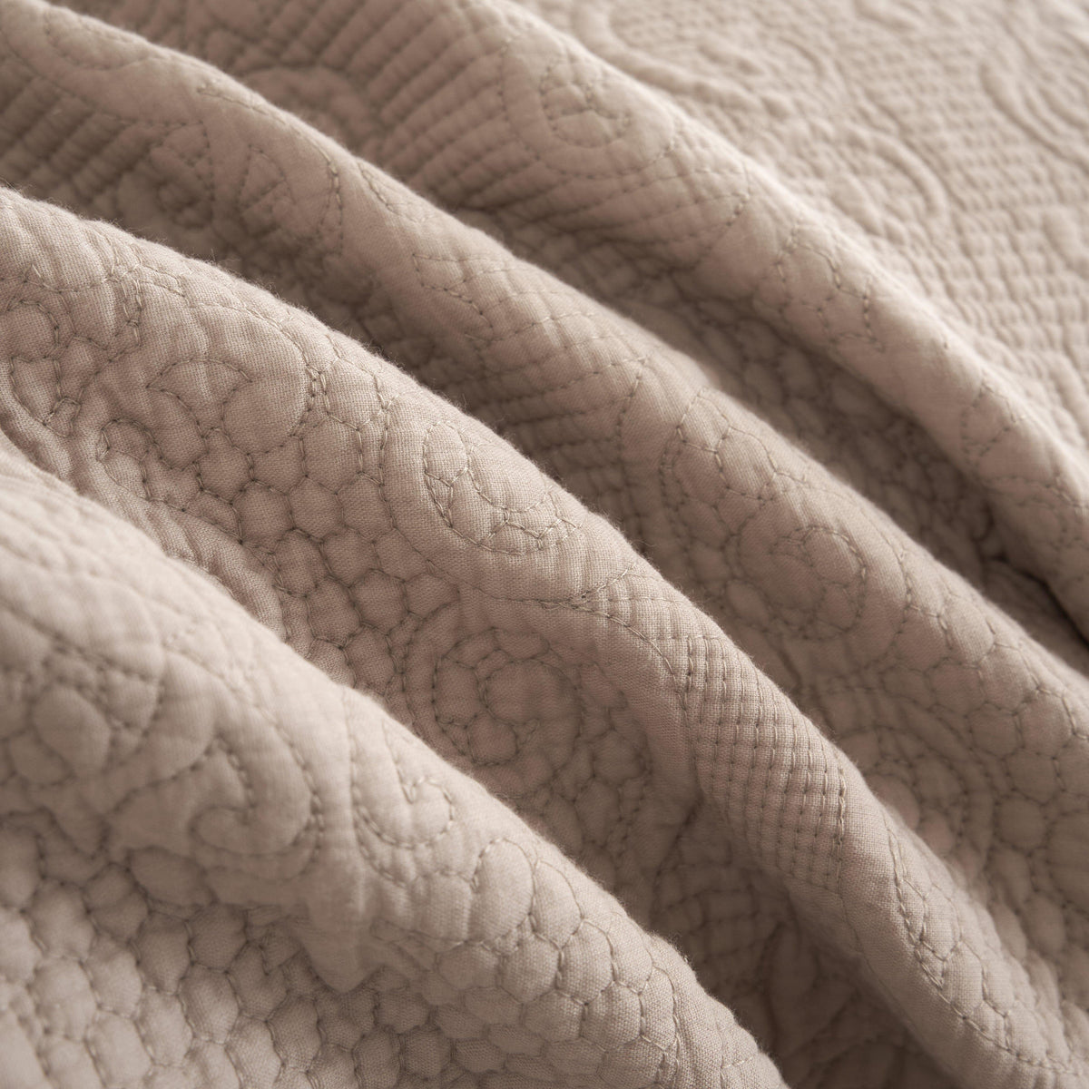 Taupe beige matelasse cotton quilted bedspread set with decorative stitching.