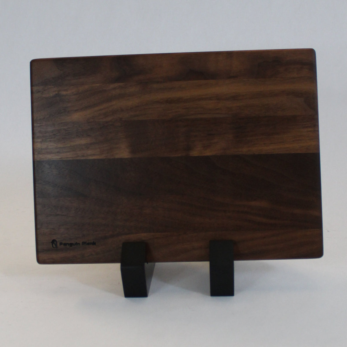 Walnut cheese board with penguin handle for outdoor dining