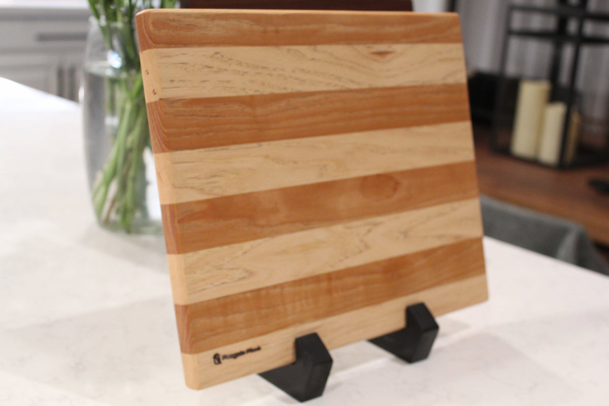 Hickory wood cheese board with a rustic, handcrafted serving plank design.