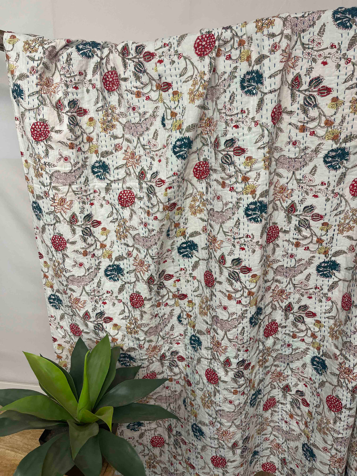 Wildflower field kantha quilt block print cotton bedspread in vibrant colors.