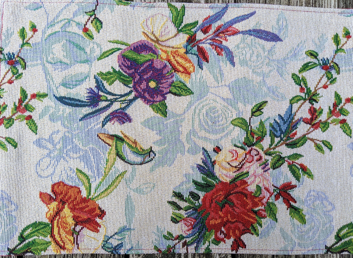 Four tropical sky blue bird and floral tapestry placemats, 13x19 inches.