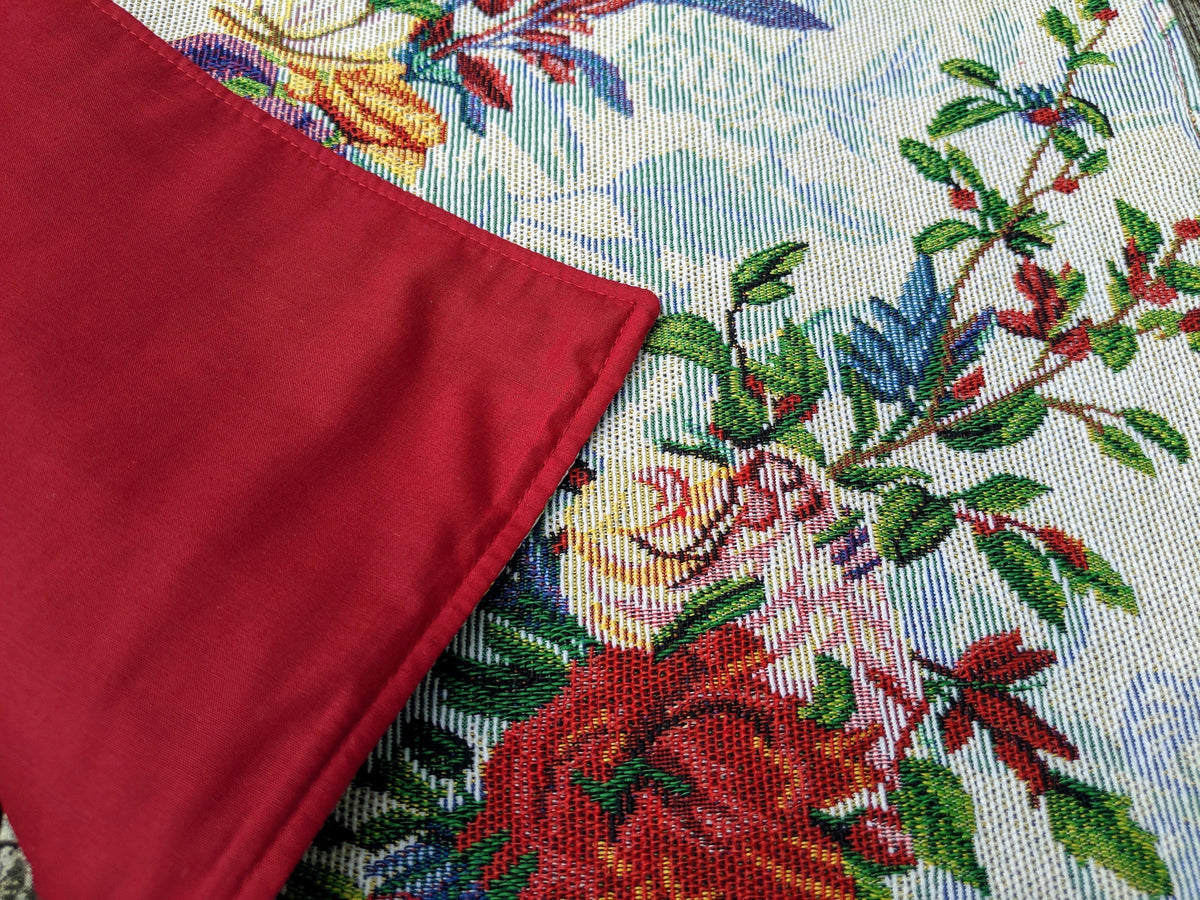 Four tropical sky blue bird and floral tapestry placemats, 13x19 inches.