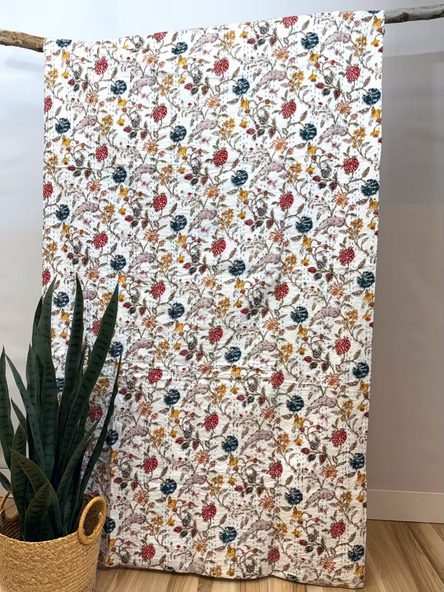 Wildflower field kantha quilt block print cotton bedspread with floral patterns.