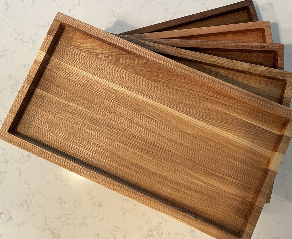 Modern tray organizer with compartments for daily essentials on a counter.