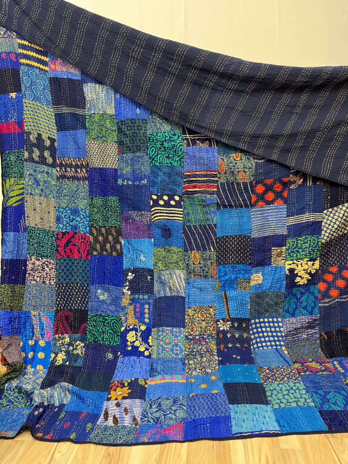 Pink patchwork silk Kantha quilt, hand-stitched by Indian artisans