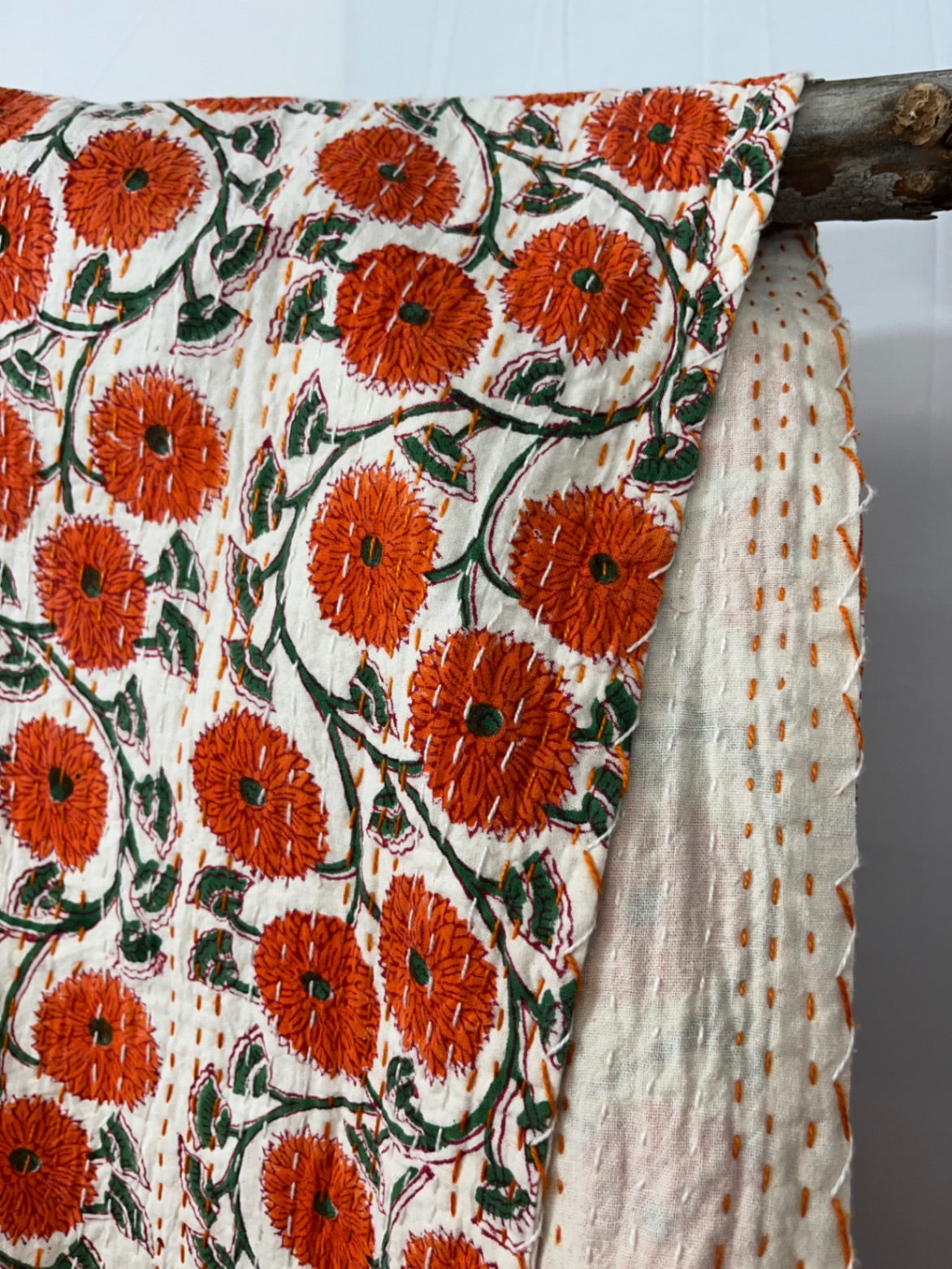 Orange poppies block print Kantha quilt, handmade in Jaipur, India.