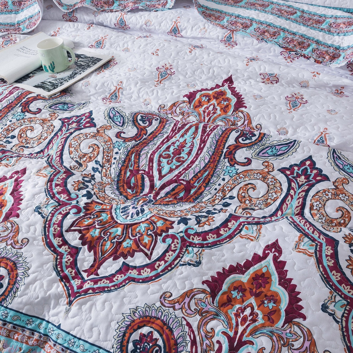 White and blue floral paisley bohemian bedspread set by DaDa Bedding.