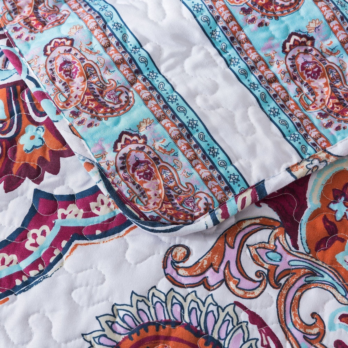 White and blue floral paisley bedspread set by DaDa Bedding.