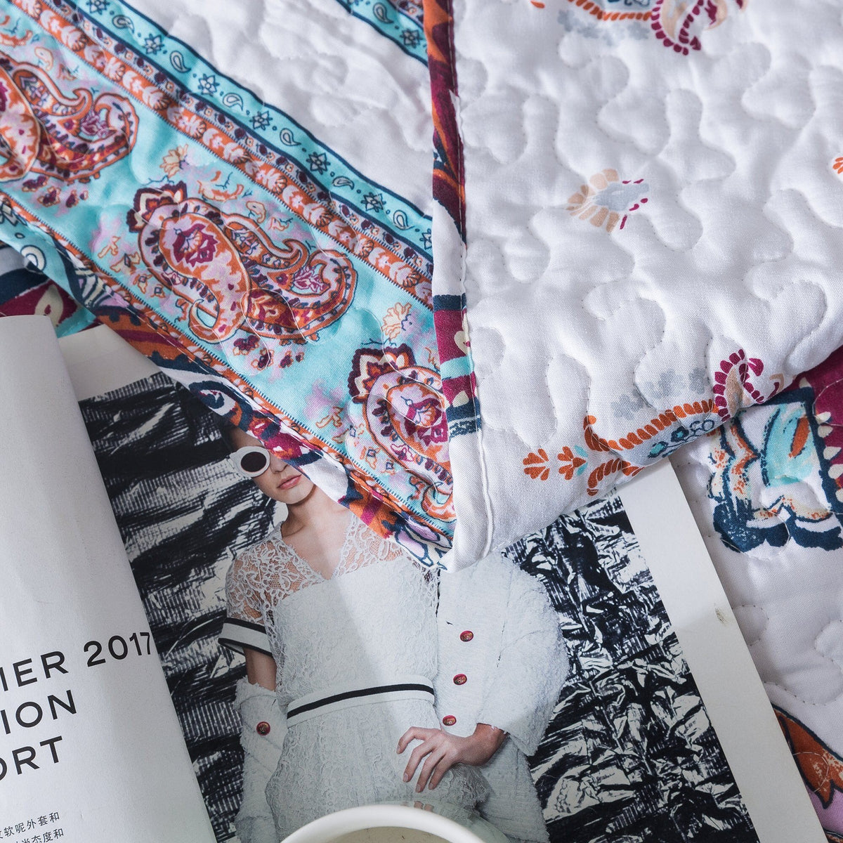 White and blue floral paisley bohemian bedspread set with pillowcases.