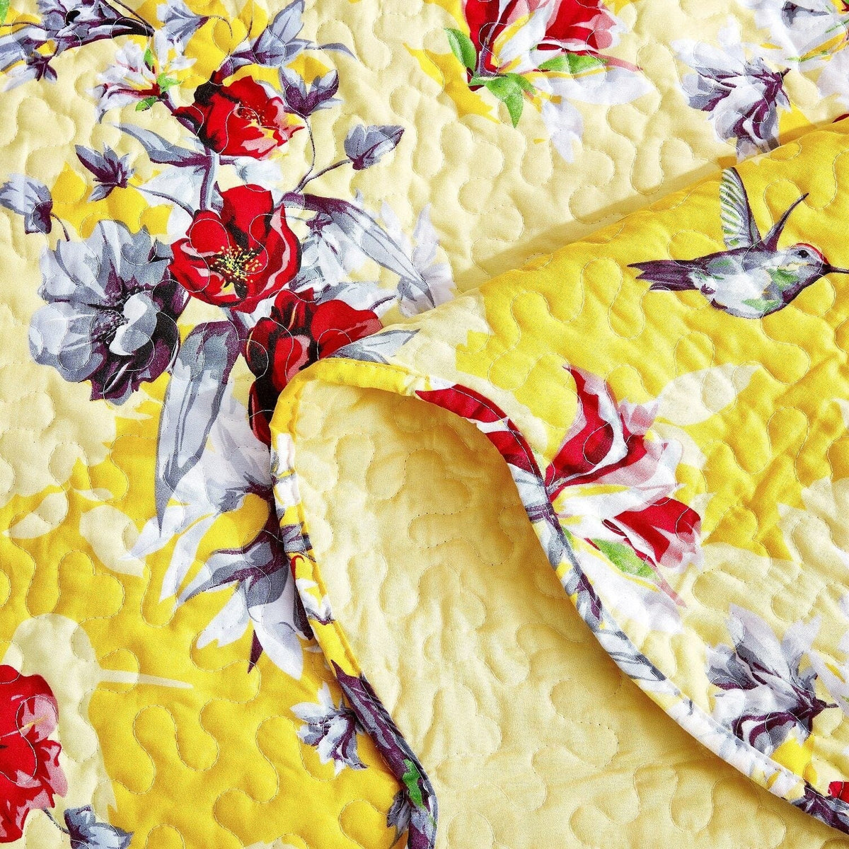 Vibrant yellow hummingbirds on floral scalloped quilted bedspread set.