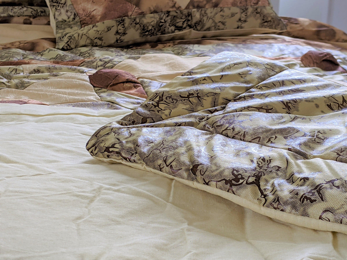 Rustic earthy floral beige and green camo comforter set.