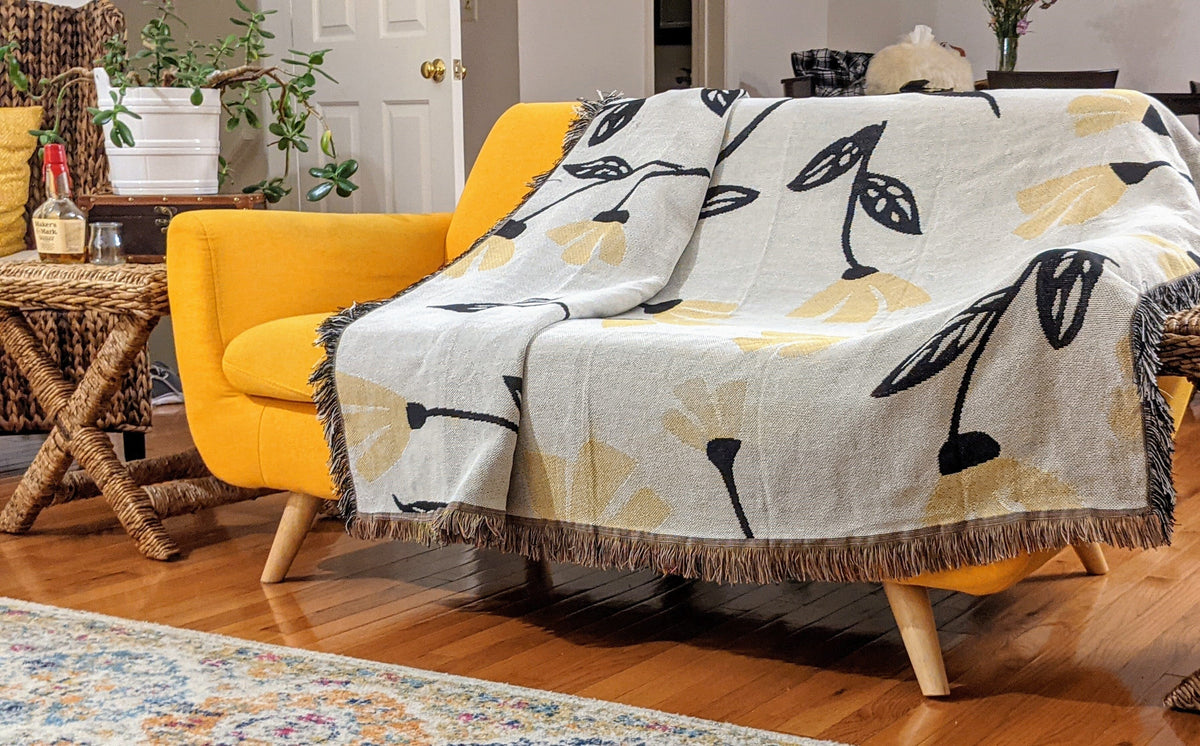 Yellow Fleur botanical throw blanket with golden floral tapestry design, 50x60 inches.
