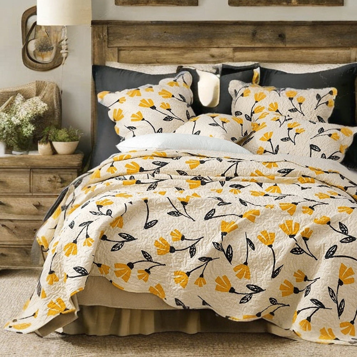 Yellow floral scalloped bedspread set on ivory cream background.
