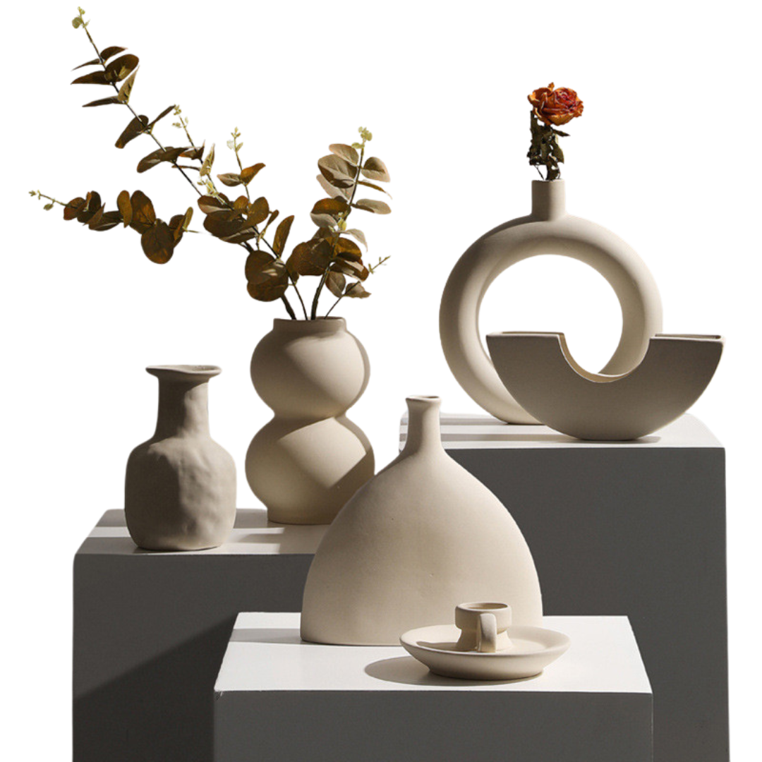 Taupe ceramic vase set with modern minimalist candle holders.