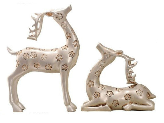 Elegant silver deer sculptures with antlers, pair.
