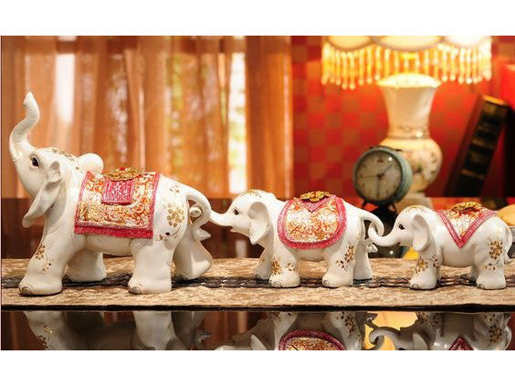 Three red jewel-covered Maharaja elephant sculptures decor set.
